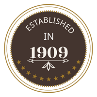 A circular logo reads “The Alamo” with a desert skyline silhouette inside, surrounded by the words “Historic Partner Hotel.”